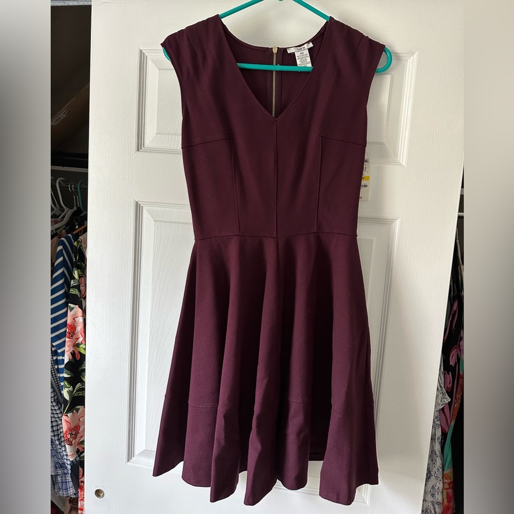 NWT burgundy colored dress. Soft with zippered back. SF home. Size medium